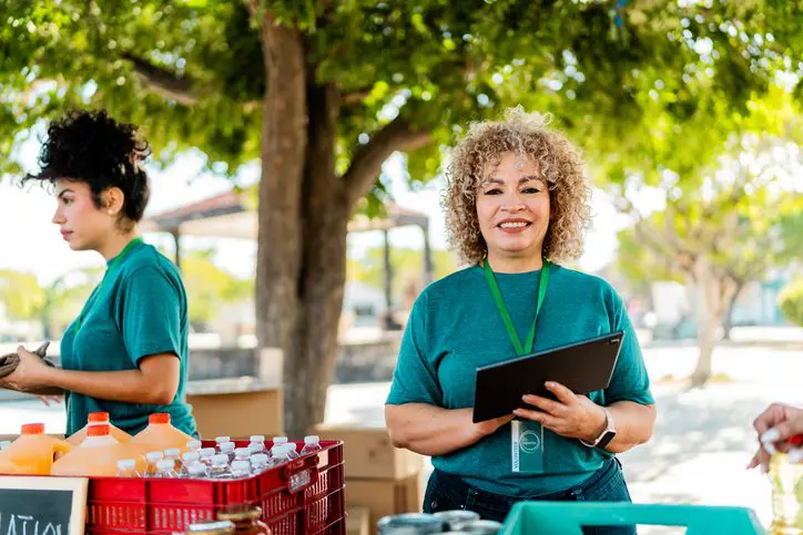 Portrait of volunteer woman organizing donations