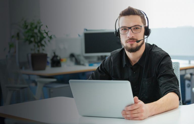 Male Worker with Headset and Laptop